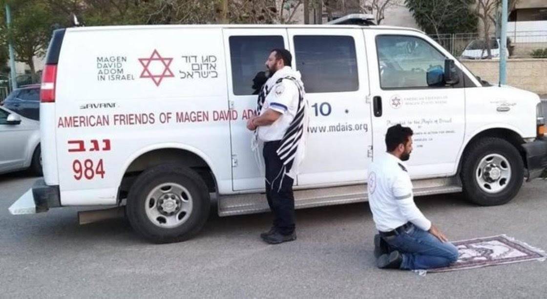 Jewish and Muslim co-workers stop for afternoon prayer
